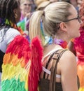 Young woman wearing rainbow angel wings attending the Gay Pride parade also known as Christopher Street Day CSD in Munich