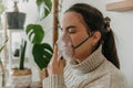 Young woman wearing a respiratory mask to facilitate proper breathing