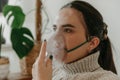 Young woman wearing a respiratory mask to facilitate proper breathing