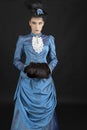 A young woman wearing an 1880s Victorian costume