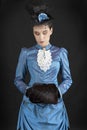 A young woman wearing an 1880s Victorian costume