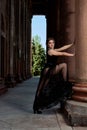 Young woman is wearing a sexy transparent black dress. Young woman modern portrait