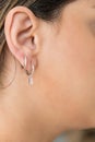 Young woman wearing silver clear sweet drop earrings