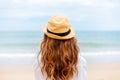 Young woman wearing sun hat on the  beach. summer, holidays, vacation, travel concept Royalty Free Stock Photo