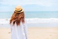 Young woman wearing sun hat on the  beach. summer, holidays, vacation, travel concept Royalty Free Stock Photo