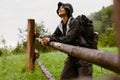 Young woman wearing trekking equipment hiking in mountains