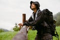 Young woman wearing trekking equipment hiking in mountains