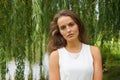 Young woman wearing white dress in a park Royalty Free Stock Photo