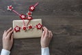 Young woman wearing white jumper holding Christmas gift box Royalty Free Stock Photo