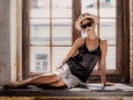 Young woman wearing white shorts, black top, hat and sunglasses Royalty Free Stock Photo