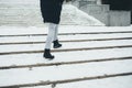 Young woman wearing winter coat and boots walking Royalty Free Stock Photo