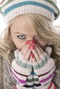 Young Woman Wearing a Wooly Hat and Gloves Royalty Free Stock Photo