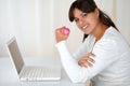 Young woman with weights in front of laptop Royalty Free Stock Photo
