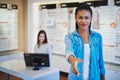 Young woman welcoming you to her store Royalty Free Stock Photo