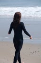 Young Woman in a Wetsuit at Beach Royalty Free Stock Photo