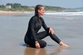 Young Woman in a Wetsuit at Beach Royalty Free Stock Photo