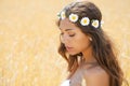 Young woman in a wheat golden field Royalty Free Stock Photo