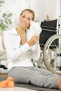 Young woman in wheelchair doing exercise