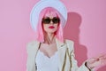 Young woman in White blazer pink hair Glamor Cosmetics color background unaltered Royalty Free Stock Photo