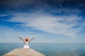 Young woman in white dress sunbathing at the seaside Royalty Free Stock Photo