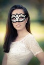 Young Woman in White Dress Wearing Mask