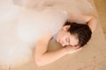 young woman in white foam relaxing in a hamam Royalty Free Stock Photo