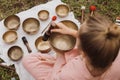 Young woman with white hair in a pink kimono plays on a singing bowl Royalty Free Stock Photo