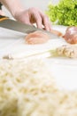 Making a Chicken Dish with Vegetables and Noodles