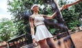 young woman in white sexy sportwear on tennis court Royalty Free Stock Photo