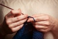 Young Woman in White Sweater Knitting Handcrafting