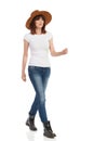 Walking Young Woman In White T-Shirt And Hat Royalty Free Stock Photo