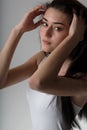 three quarter portrait of Gathering hair, beautiful skin Royalty Free Stock Photo