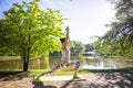 Young woman in white top practicing yoga in beautiful nature.