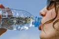 A young woman who drinks water very thirsty