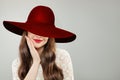 Young woman in wide broad brim hat. Pretty model with red lips makeup and cute smile portrait Royalty Free Stock Photo