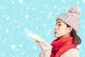 Young woman in winter clothes and  Blowing Snow Royalty Free Stock Photo