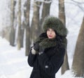 Young woman in winter clothes in the park