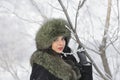 Young woman in winter clothes in the park