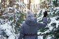 Young woman in the winter forest on a sunset background, close-up Royalty Free Stock Photo