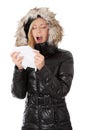 Young woman in winter jacket holding tissue Royalty Free Stock Photo