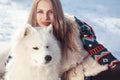 Young woman in winter park with dog Royalty Free Stock Photo