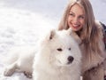 Young woman in winter park with dog Royalty Free Stock Photo