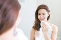 Young woman wiping her face with towel in bathroom. Royalty Free Stock Photo