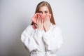 Young woman wiping her face with towel in bathroom. Royalty Free Stock Photo