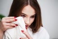 Young woman wiping her face with towel in bathroom. Royalty Free Stock Photo