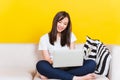 Young woman work from home she sitting on sofa using laptop computer in house Royalty Free Stock Photo