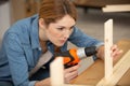 young woman worker in carpenter workroom Royalty Free Stock Photo