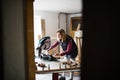 Young woman worker in the carpenter workroom. Royalty Free Stock Photo