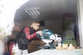 Young woman worker in the carpenter workroom. Royalty Free Stock Photo