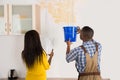 Young Woman And Worker Collecting Water In Bucket From Ceiling Royalty Free Stock Photo